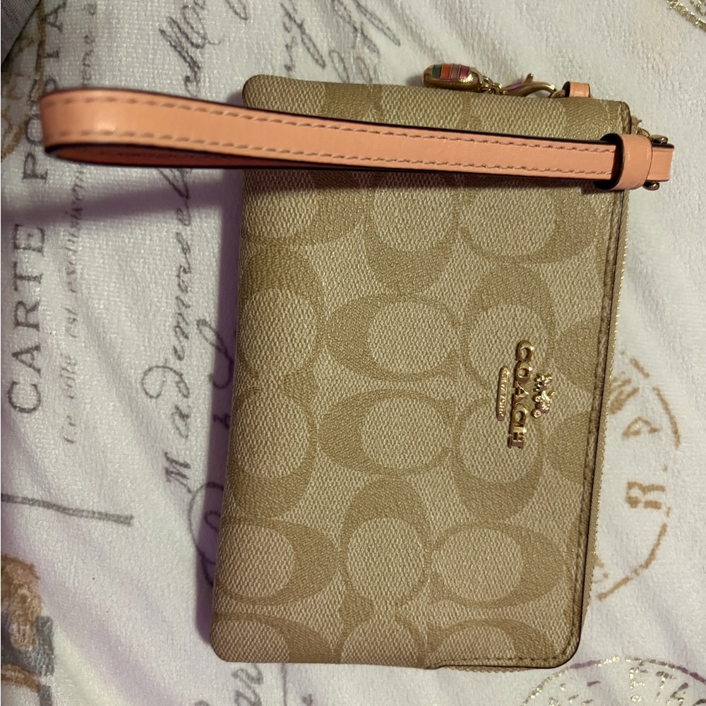 Coach Beige Wristlet with Pink Strap